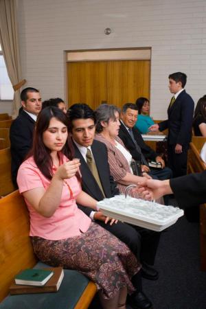 Woman partaking of the sacrament via lds.org